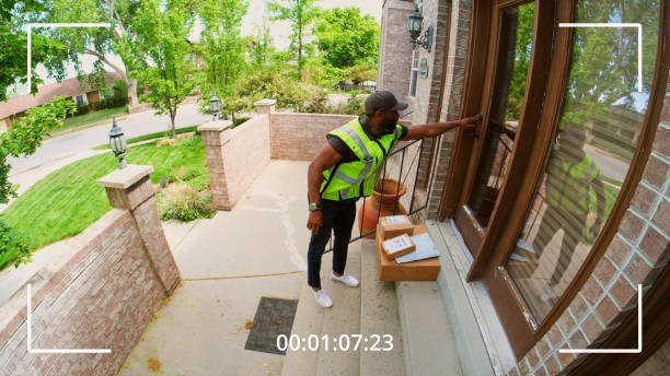 istock Home Security Camera Footage of Package Delivery 1496748136