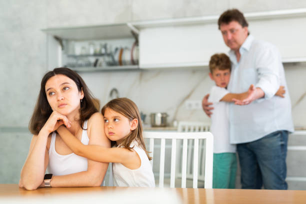 istock Family with two children in kitchen during quarrel 1496752473