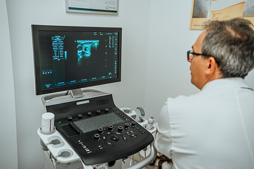 Doctor conducting ultrasound examination in a medical clinic