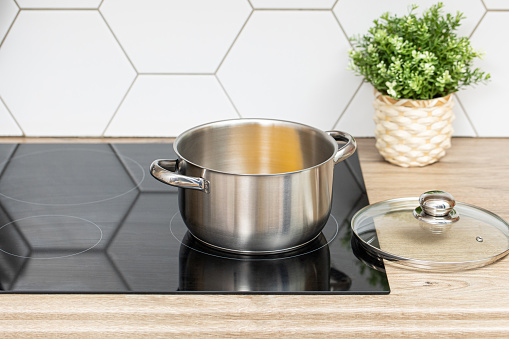 Stainless steel cooking pot on modern kitchen