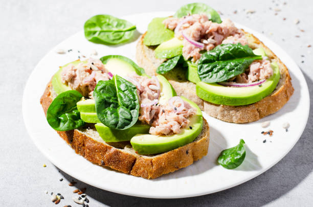 istock Tuna Avocado Toasts, Healthy Snack or Breakfast on Bright Background 1496760137