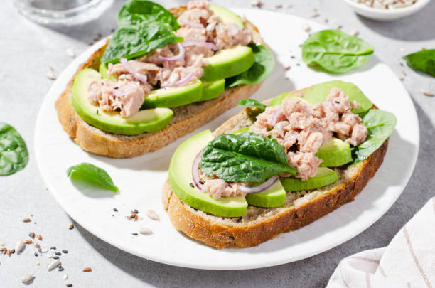 istock Tuna Avocado Toasts, Healthy Snack or Breakfast on Bright Background 1496760196