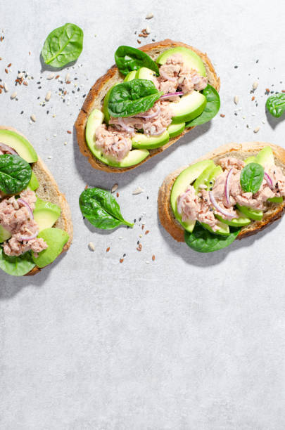 istock Tuna Avocado Toasts, Healthy Snack or Breakfast on Bright Background 1496760763