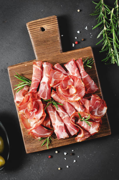 istock Cured Meat Platter, Coppa with Spices, Italian Antipasto, Appetizer over Dark Background 1496761689