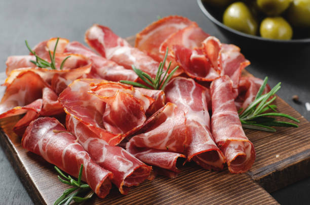 istock Cured Meat Platter, Coppa with Spices, Italian Antipasto, Appetizer over Dark Background 1496761703