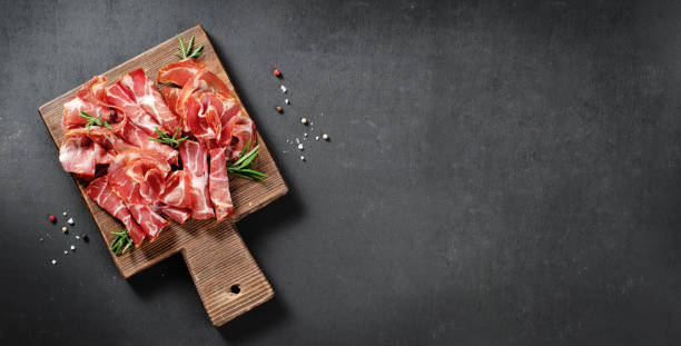 istock Cured Meat Platter, Coppa with Spices, Italian Antipasto, Appetizer over Dark Background 1496761726