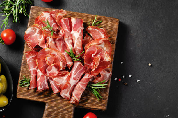 istock Cured Meat Platter, Coppa with Spices, Italian Antipasto, Appetizer over Dark Background 1496761763