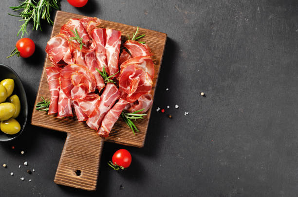 istock Cured Meat Platter, Coppa with Spices, Italian Antipasto, Appetizer over Dark Background 1496761951