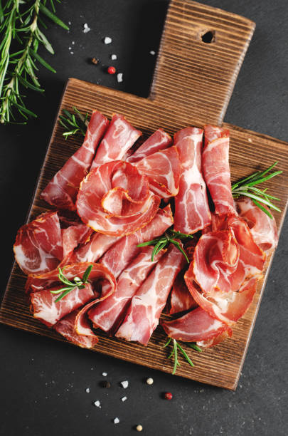 istock Cured Meat Platter, Coppa with Spices, Italian Antipasto, Appetizer over Dark Background 1496762027