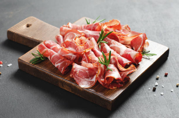 istock Cured Meat Platter, Coppa with Spices, Italian Antipasto, Appetizer over Dark Background 1496762071