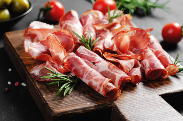 istock Cured Meat Platter, Coppa with Spices, Italian Antipasto, Appetizer over Dark Background 1496763059