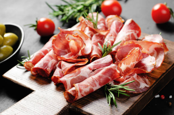 istock Cured Meat Platter, Coppa with Spices, Italian Antipasto, Appetizer over Dark Background 1496763351