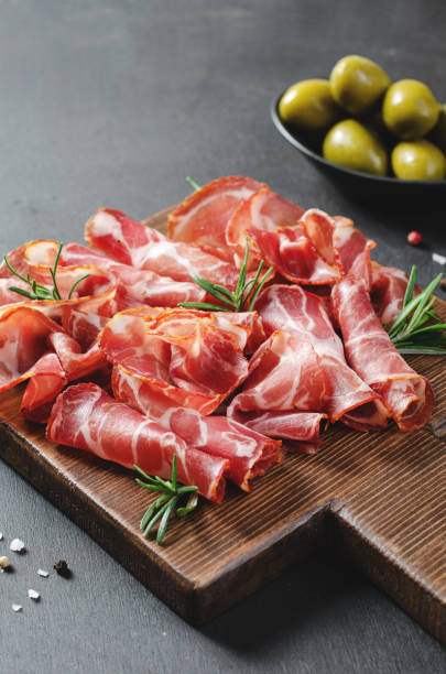 istock Cured Meat Platter, Coppa with Spices, Italian Antipasto, Appetizer over Dark Background 1496763372