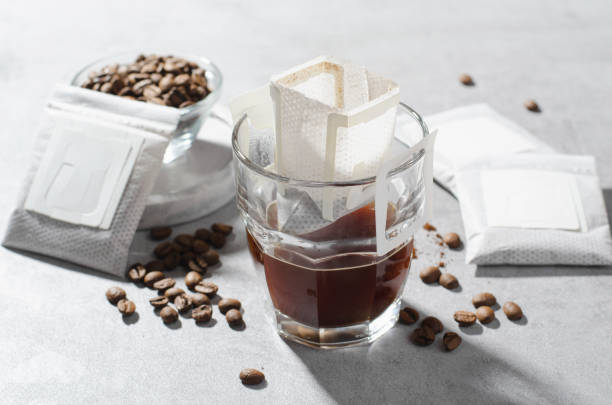 istock Drip Coffee Bag in a Cup, Coffee Trend, Quick Way to Brew Ground Coffee 1496763404