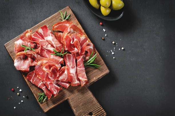 istock Cured Meat Platter, Coppa with Spices, Italian Antipasto, Appetizer over Dark Background 1496763474