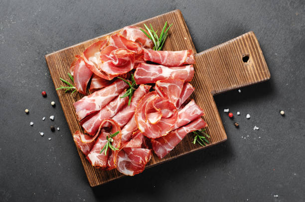 istock Cured Meat Platter, Coppa with Spices, Italian Antipasto, Appetizer over Dark Background 1496763505