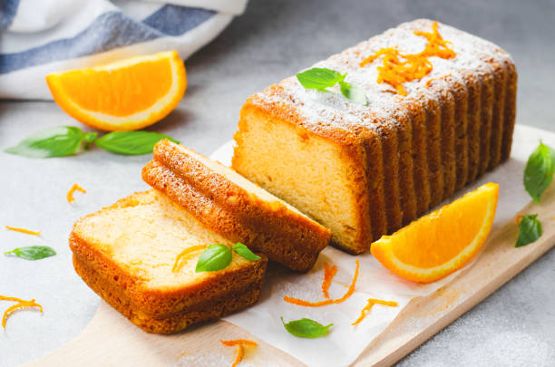 istock Orange Pound Cake, Moist Loaf Cake with Orange Zest on Bright Background 1496764530