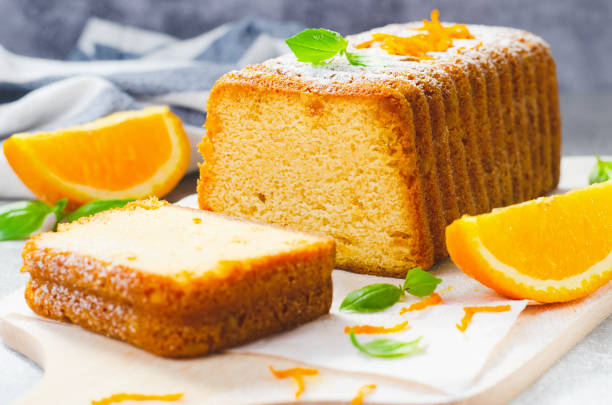 istock Orange Pound Cake, Moist Loaf Cake with Orange Zest on Bright Background 1496764923