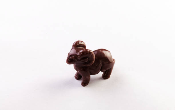 istock Small Brown Stone Carving Of Ram On White Background 1496764978
