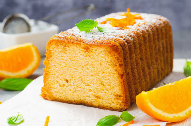 istock Orange Pound Cake, Moist Loaf Cake with Orange Zest on Bright Background 1496765181