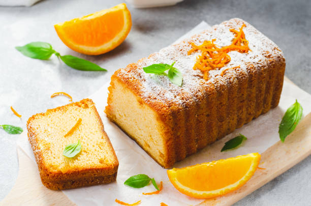 istock Orange Pound Cake, Moist Loaf Cake with Orange Zest on Bright Background 1496765772