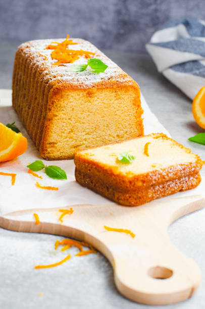 istock Orange Pound Cake, Moist Loaf Cake with Orange Zest on Bright Background 1496765822