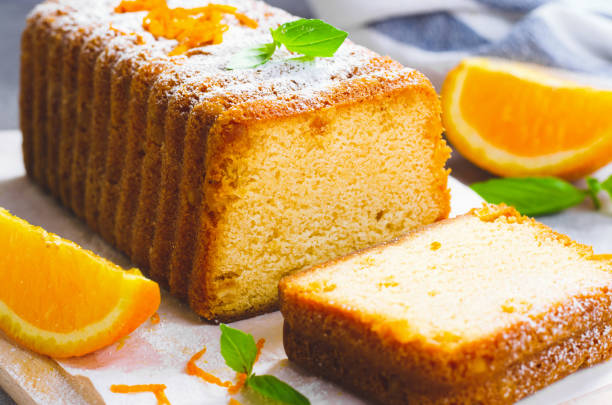 istock Orange Pound Cake, Moist Loaf Cake with Orange Zest on Bright Background 1496765900
