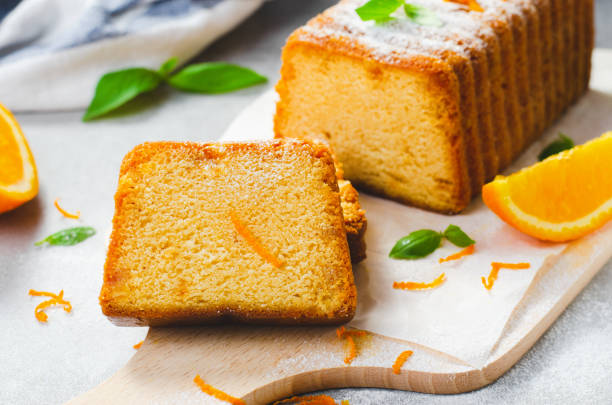 istock Orange Pound Cake, Moist Loaf Cake with Orange Zest on Bright Background 1496766150