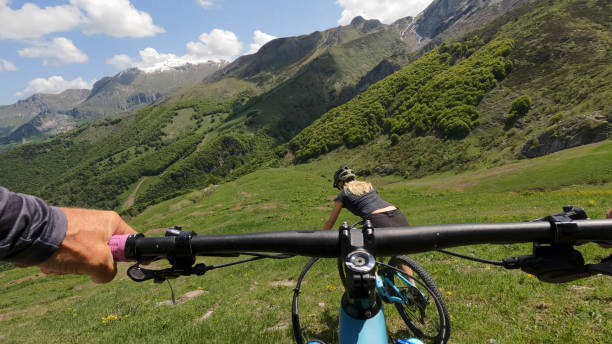 istock First person perspective on biking through alpine meadow 1496766157