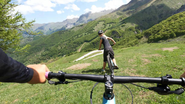 istock First person perspective on biking through alpine meadow 1496766319