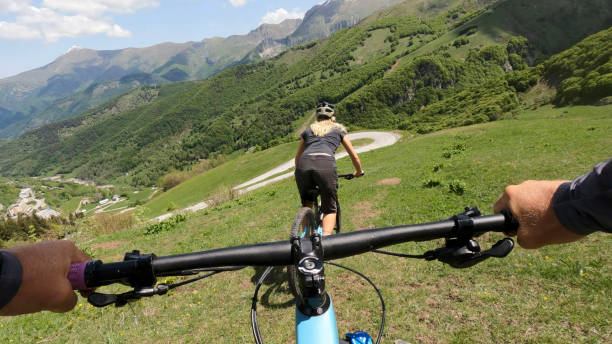 First person perspective on biking through alpine meadow
