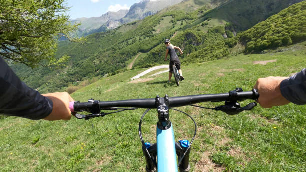 istock First person perspective on biking through alpine meadow 1496766325