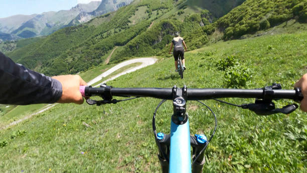 istock First person perspective on biking through alpine meadow 1496766327