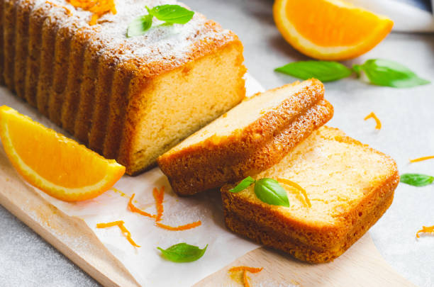 istock Orange Pound Cake, Moist Loaf Cake with Orange Zest on Bright Background 1496766522