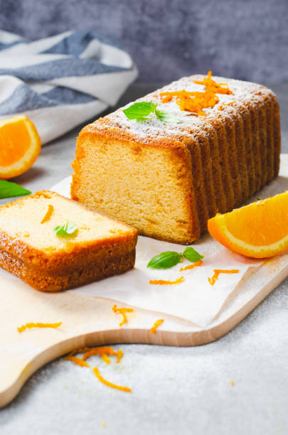 istock Orange Pound Cake, Moist Loaf Cake with Orange Zest on Bright Background 1496766552