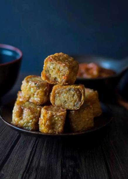 istock Fried tofu filled with egg and sliced vegetables 1496769969