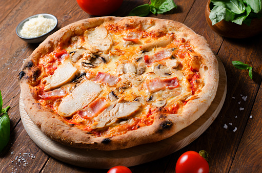 Frozen Chicken Mushroom Pizza on Dark Background, Stone Baked Pizza