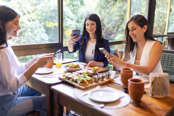 istock Co-workers taking pictures of their food 1496771909