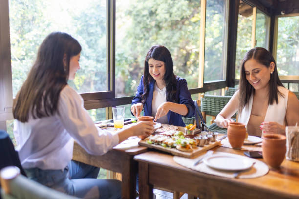 istock Businesswomen enjoying their meal 1496771983