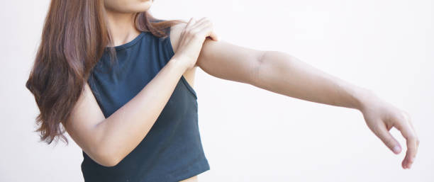 istock Asian woman having shoulder pain. 1496774902