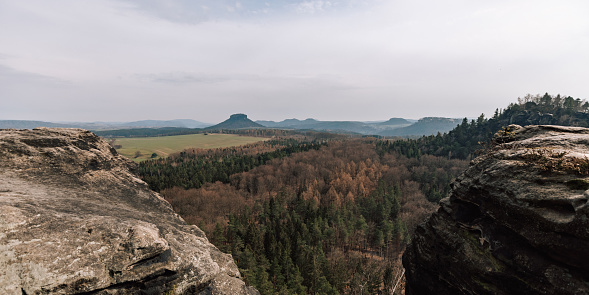 Swiss Saxony, panoramic photography of rocks, native Sächsische Schweiz, climbing area and national park in the Elbe Sandstone Mountains photo. Panorama picture in Europe, german landscape. The concept for traveling and tourism.