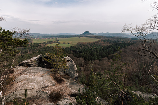 Swiss Saxony, panoramic photography of rocks, native Sächsische Schweiz, climbing area and national park in the Elbe Sandstone Mountains photo. Panorama picture in Europe, german landscape. The concept for traveling and tourism.