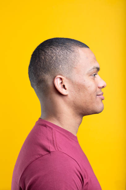 istock Afro-American individual, barely smiling, profile view 1496779309