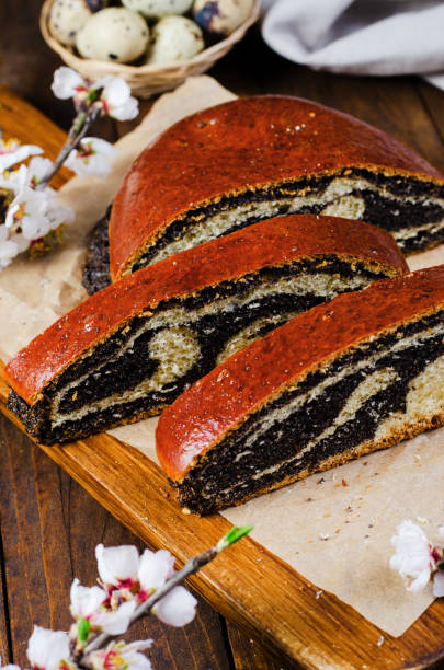 istock Poppy Seed Cake, Traditional Cake on Wooden Easter Table 1496781977