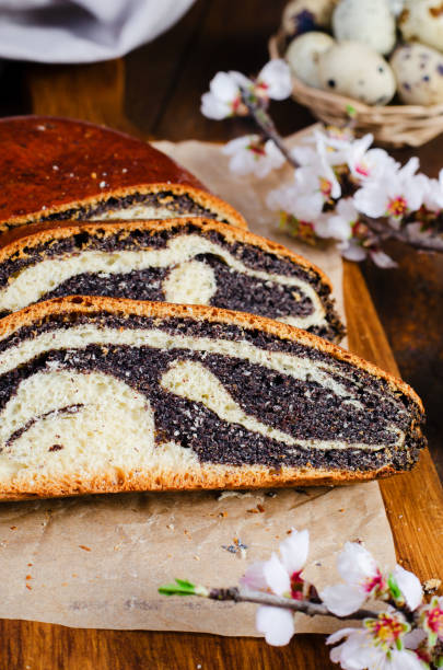 istock Poppy Seed Cake, Traditional Cake on Wooden Easter Table 1496782977