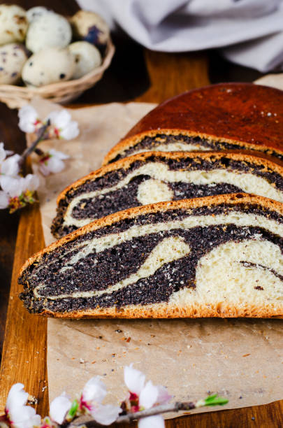 istock Poppy Seed Cake, Traditional Cake on Wooden Easter Table 1496782980