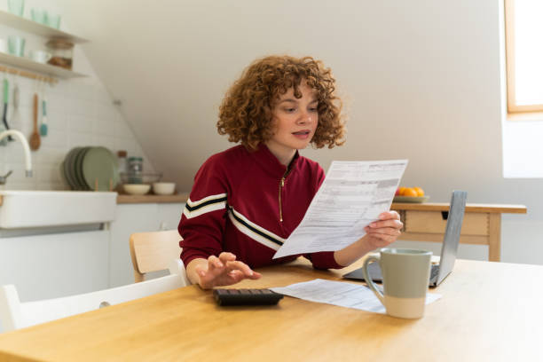 istock Happy young woman enjoying working online 1496783445