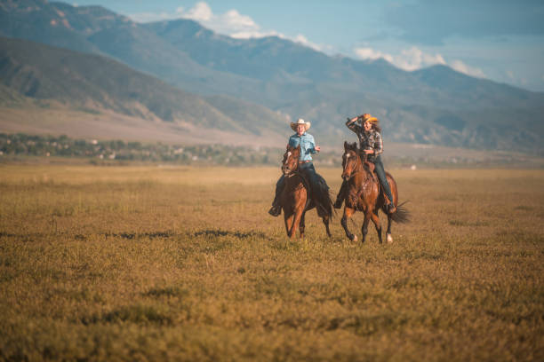 istock Active Caucasian Couple Having Fun Horseback Riding Together 1496785139