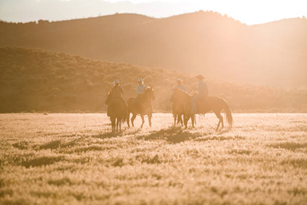 istock Golden Hour Fun, Family Horseback Riding 1496785151