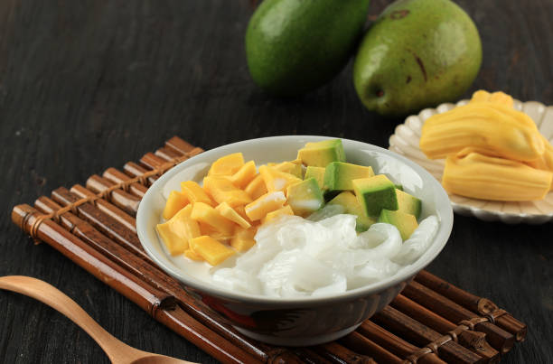 istock Avocado Coconut Jackfruit Ice Cocktail on Black Wooden Background, 1496785222